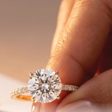 Round brilliant pave ring for a guide to carat weight and visible presence.